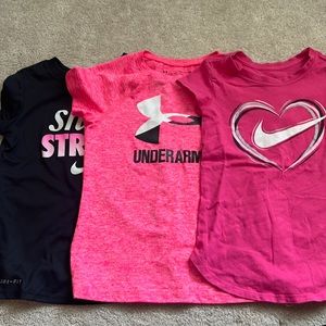 Three Nike and UA shirts